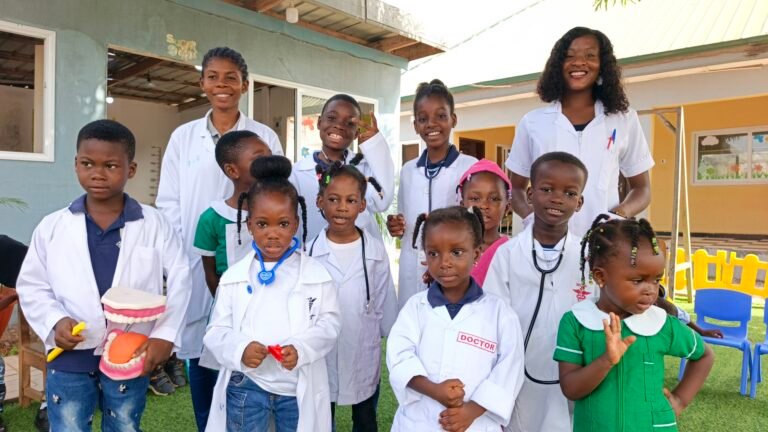 Children in lab coats during a science activity at Brainy Explorers Montessori